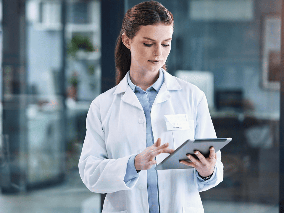 Medical professionals in discussion with city skyline background
