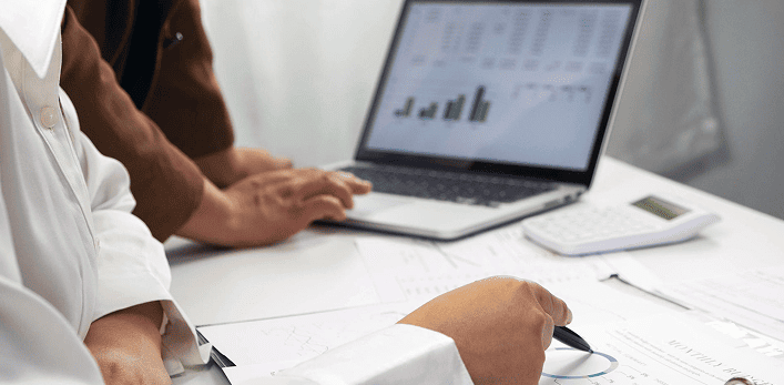 Medical professionals in discussion with city skyline background